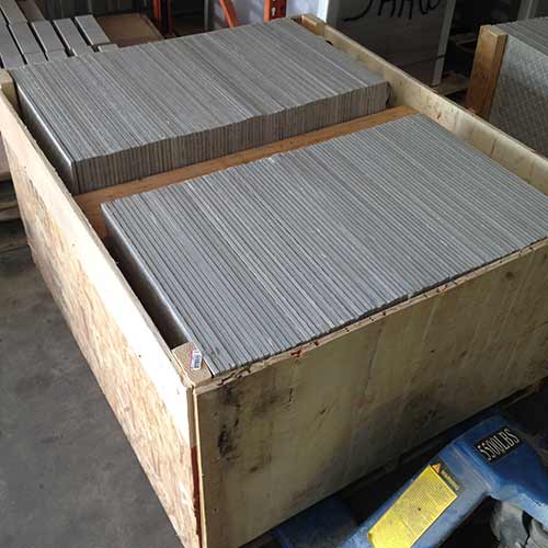 Image of re-sized tile stacked in a custom crate awaiting shipment